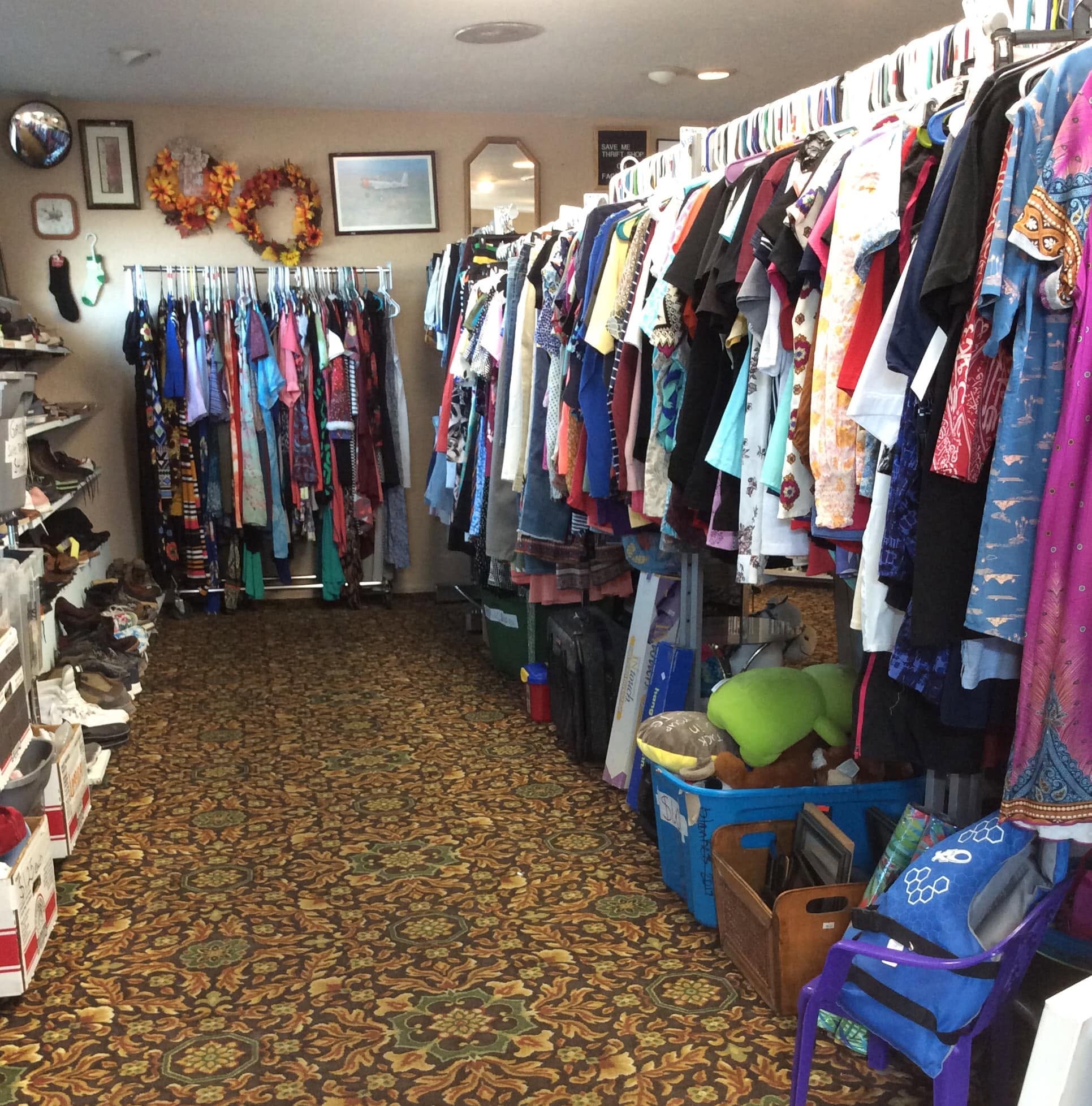 Clean, organized clothing racks at Save Me Thrift Shop
